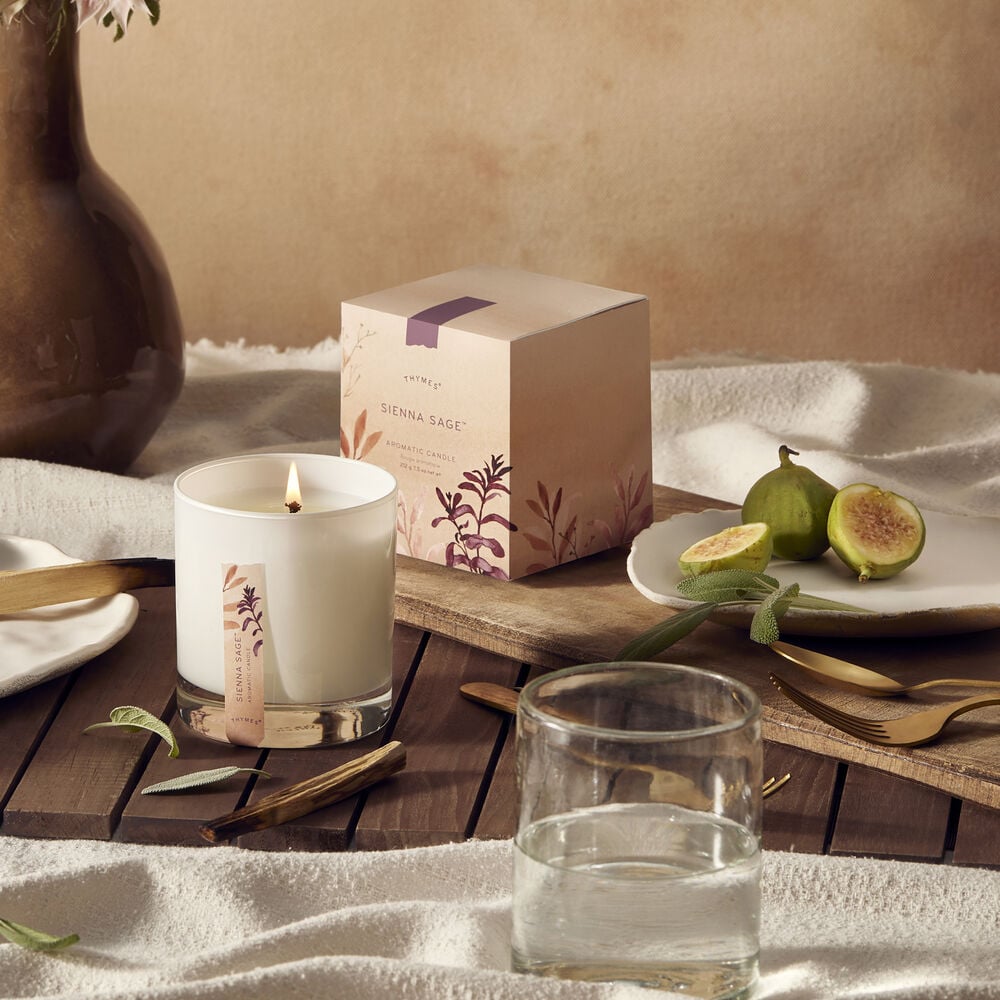 Thymes Sienna Sage Candle on dining table with figs image number 2